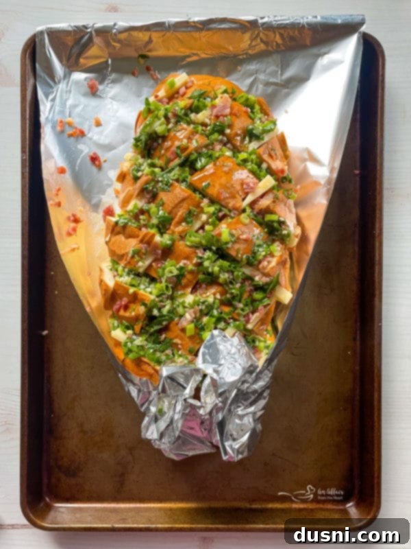 Drizzling garlic butter on Crack Bread