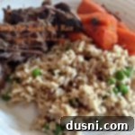 Slow Cooker Pot Roast and Rice 2 Roast, rice and carrots on a white plate