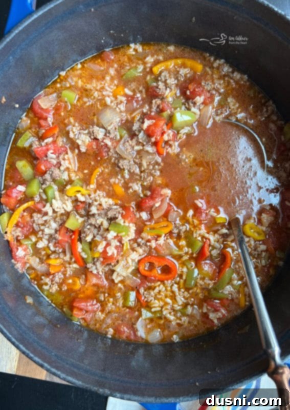 A bowl of hot Stuffed Pepper Soup ready to be served, showcasing the rich colors and textures.