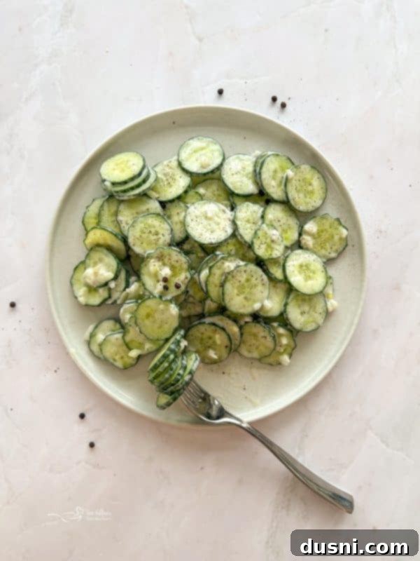Another enticing shot of Cucumber Ranch Salad in a white serving bowl.