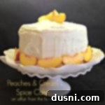 Side view of Peaches & cream spice cake on a white cake dish with text "peaches & cream spice cake"