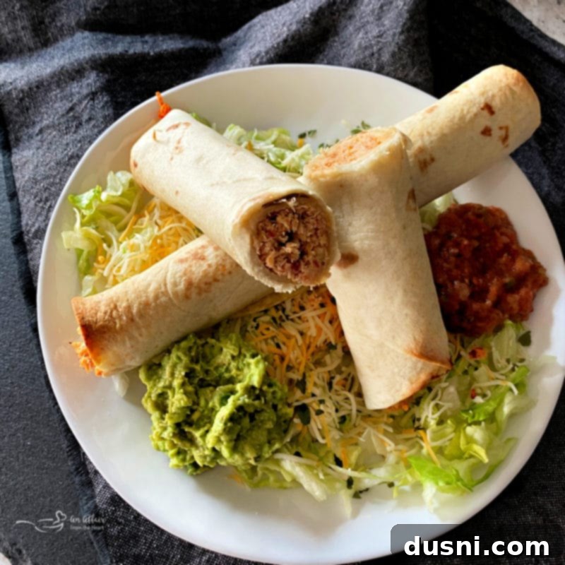 Baked Chicken Taquitos on a baking sheet before cooking