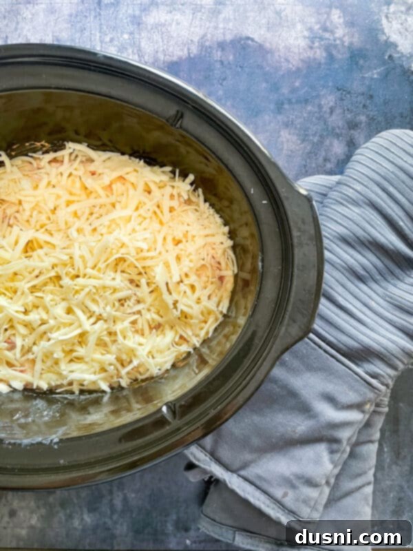 Crock Pot Reuben Dip cooking in a slow cooker