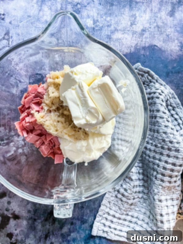 Mixing all ingredients for Reuben Dip in a bowl