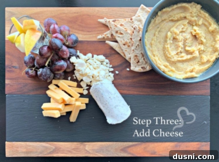 Sun-Kissed Mezze Platter with Creamy Cauliflower Hummus 14 Step three: Arranging Mediterranean cheeses like feta, goat, and smoked gouda