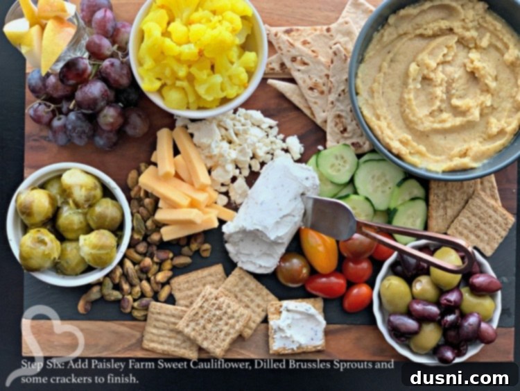 Sun-Kissed Mezze Platter with Creamy Cauliflower Hummus 17 Step six: Finishing the Mediterranean cheeseboard with Paisley Farm products and crackers