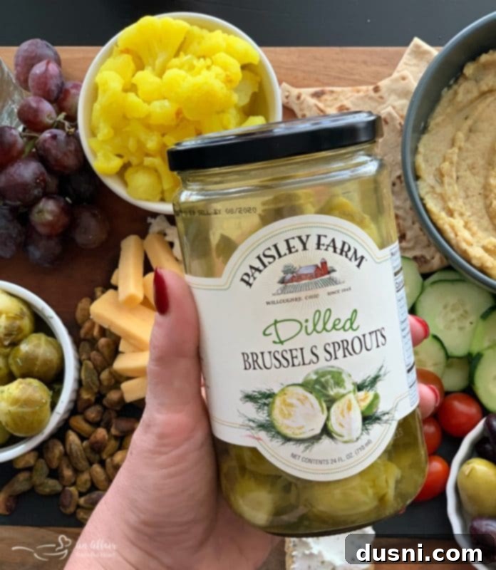 Sun-Kissed Mezze Platter with Creamy Cauliflower Hummus 18 Paisley Farm Dilled Brussels Sprouts on a Mediterranean Cheeseboard