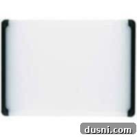 Utility cutting board with non-slip grips for safe food prep.