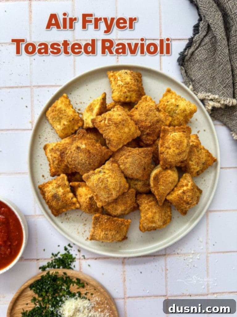 Air Fryer Toasted Ravioli with dipping sauce, garnished.