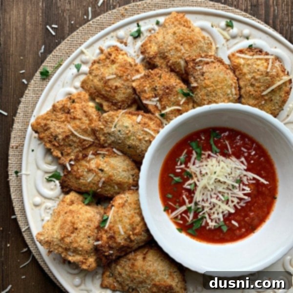 Toasted/Fried Ravioli in an air fryer, golden brown and crispy.