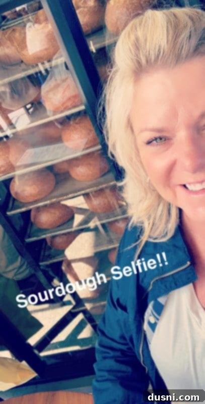Author posing with sourdough bread in San Francisco