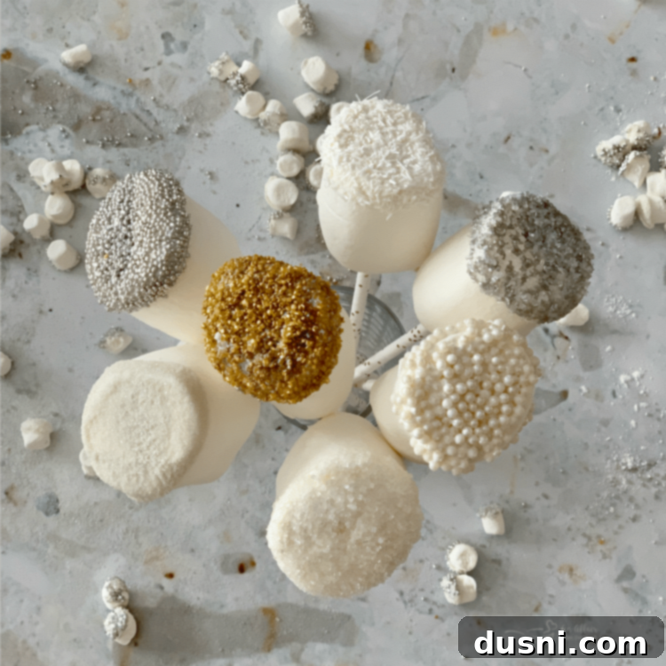 Enchanted Winter Mix 12 Arrangement of White Chocolate Dipped Marshmallows setting on parchment paper