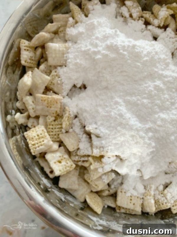 Enchanted Winter Mix 5 Winter Wonderland Snack Mix featuring Chex cereal coated in white chocolate and powdered sugar