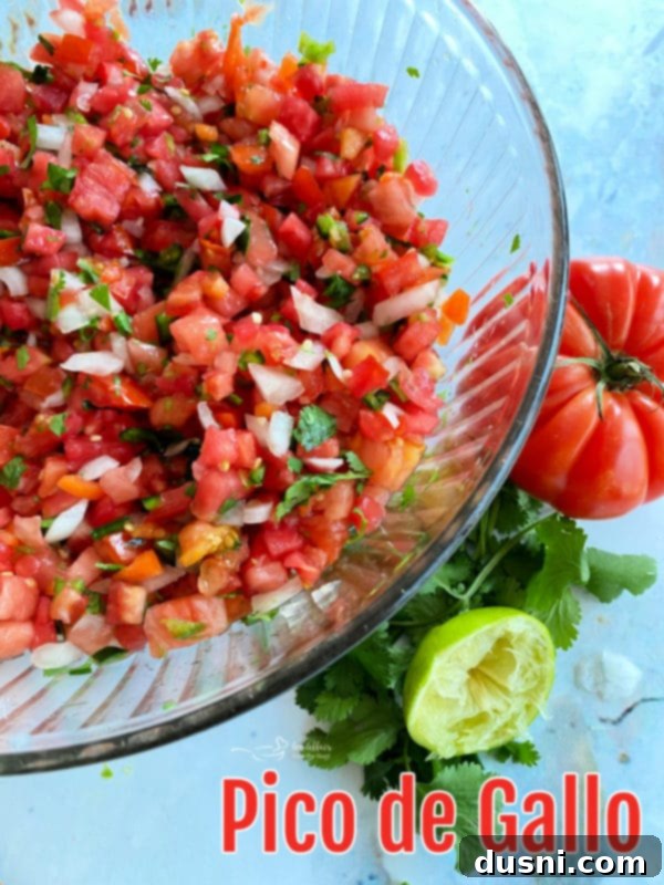Fresh Tomato Salsa 12 Overhead view of a bowl of Pico de Gallo surrounded by fresh ingredients