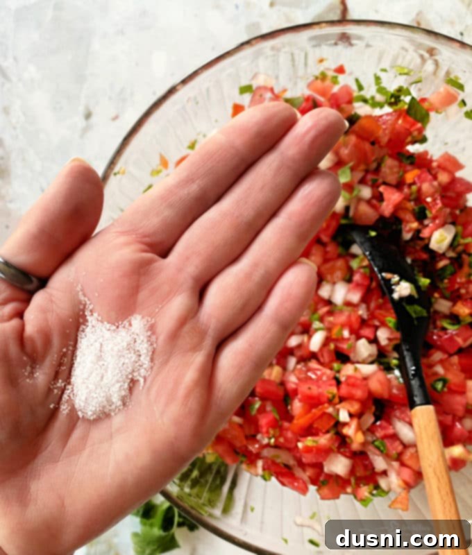 Fresh Tomato Salsa 7 Mixing chopped ingredients in a bowl