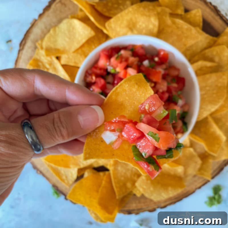 Fresh Tomato Salsa 8 Close-up of Pico de Gallo being seasoned with salt and lime