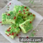 Grinch Fudge stacked on parchment paper