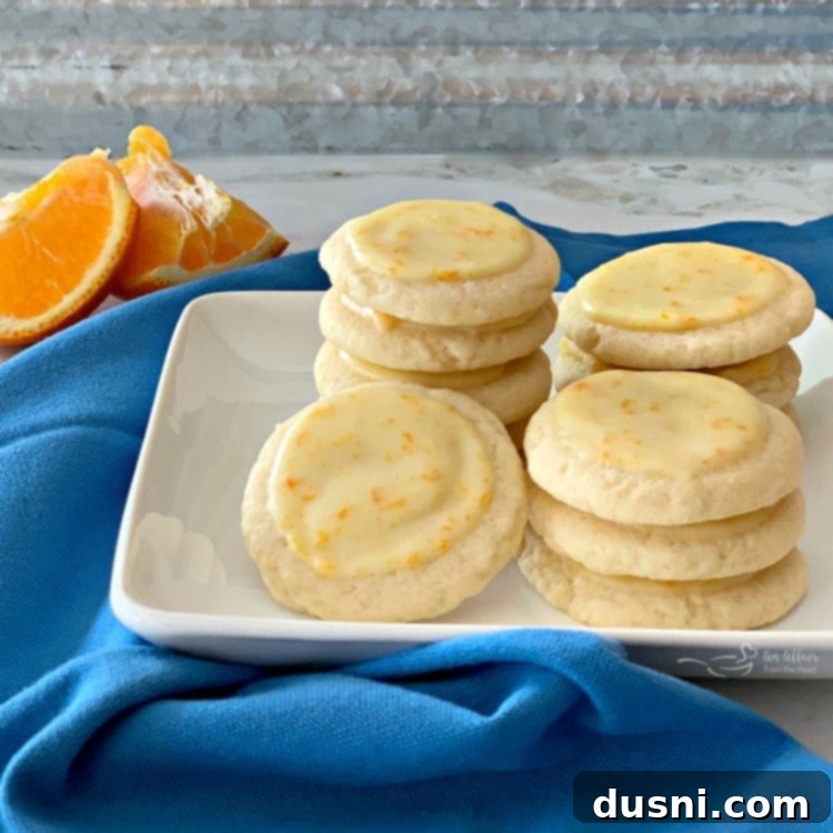 Velvet Orange Dream Cookies 2 Delicious Orange Meltaway Cookies stacked on a plate