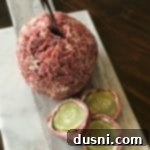 Zesty Dill Pickle Cheese Ball 12 Dill Pickle Wrap Cheese Ball and slices of dill pickle wrap on a cutting board