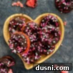 Decadent Baked Chocolate Covered Strawberry Donuts 21 Chocolate Covered Strawberry Donuts stacked in a hearty shaped platter.