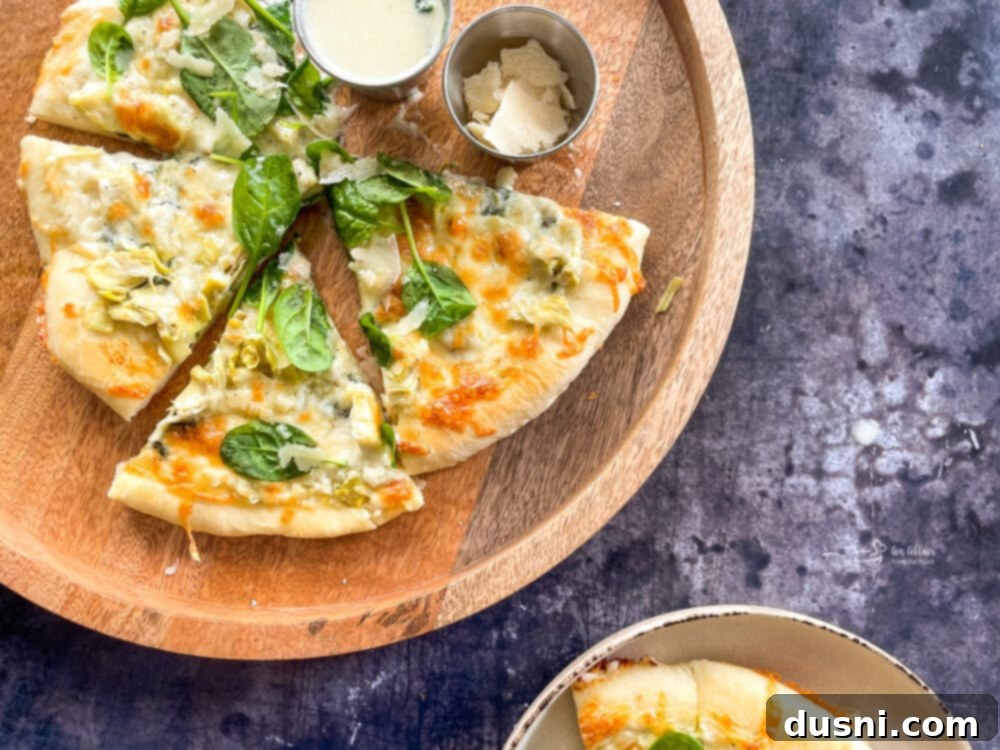Spinach Artichoke Alfredo Pizza slices