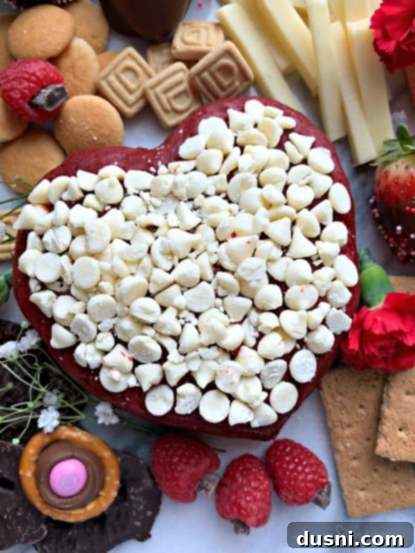 Crimson Velvet Cheese Bomb 3 Heart Shaped Red Velvet Cheese Ball, beautifully presented for a romantic occasion or Valentine's Day dessert.