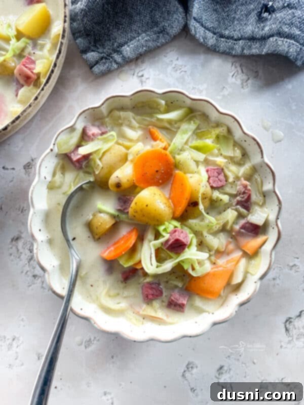 Corned Beef and Cabbage Comfort Soup 2 Creamy Corned Beef & Cabbage Soup in a rustic bowl