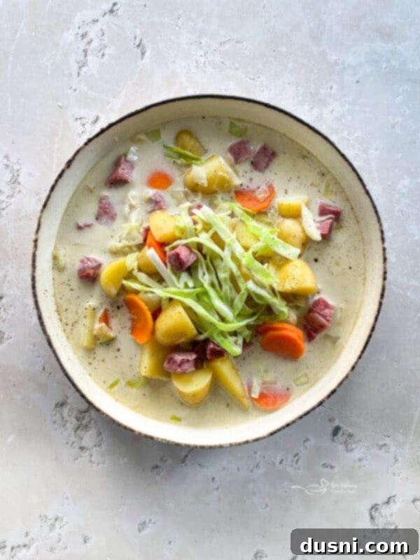 Corned Beef and Cabbage Comfort Soup 12 Creamy Corned Beef & Cabbage Soup in a white bowl