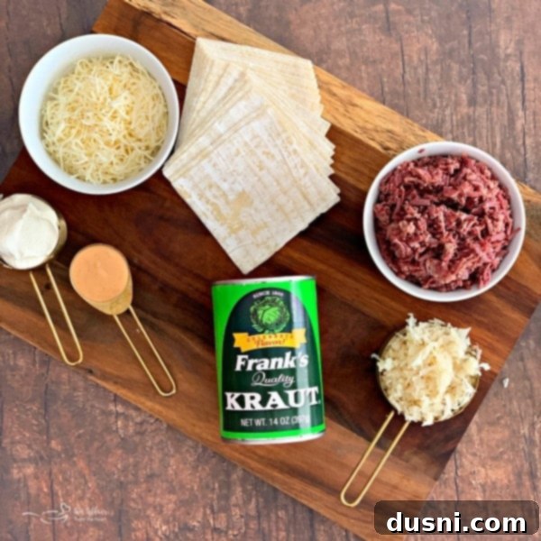 Ingredients for Reuben Wonton Purses laid out: Swiss cheese, cream cheese, Thousand Island, Frank's Kraut, corned beef, scallions