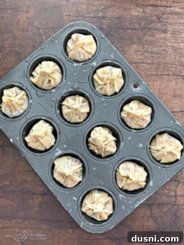 Sealing the Reuben Wonton Purses by pinching and twisting the tops