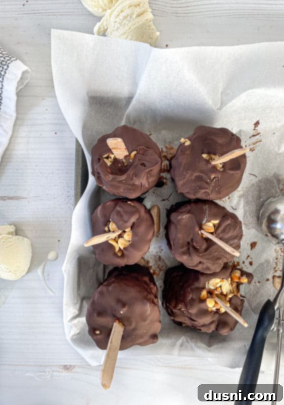 Six perfectly coated Homemade Buster Bars resting on a tray