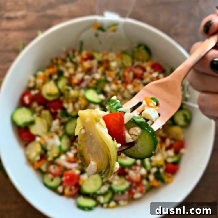 Close-up of a bite of Greek Cauliflower Rice Salad