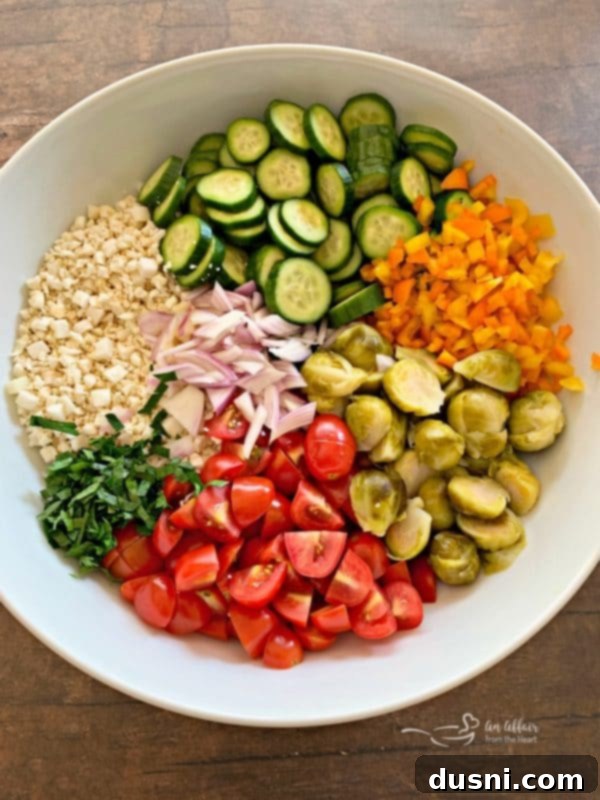 Ingredients for Greek Cauliflower Rice Salad being prepped