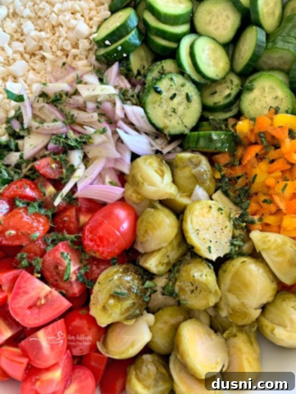 Prepped ingredients for Greek Cauliflower Rice Salad