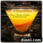 Side view of Citrus Basil Martini with text of the same