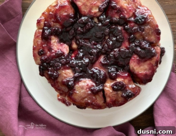 Caramelized Blueberry Upside-Down Rolls 2 Blueberry Sweet Rolls: A plate of golden-brown, glistening upside-down blueberry sweet rolls, ready to be served for brunch or breakfast.