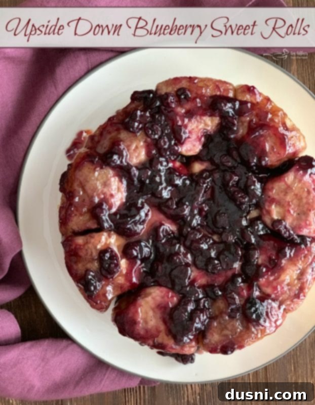 Caramelized Blueberry Upside-Down Rolls 10 Blueberry Sweet Rolls: A close-up shot of an individual upside-down blueberry sweet roll, showing the sticky blueberry topping and fluffy dough.