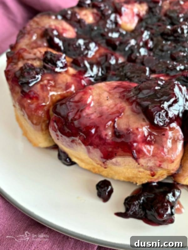 Caramelized Blueberry Upside-Down Rolls 13 Blueberry Sweet Rolls: A beautifully plated stack of upside-down blueberry sweet rolls, ready for serving, highlighting their golden crust.