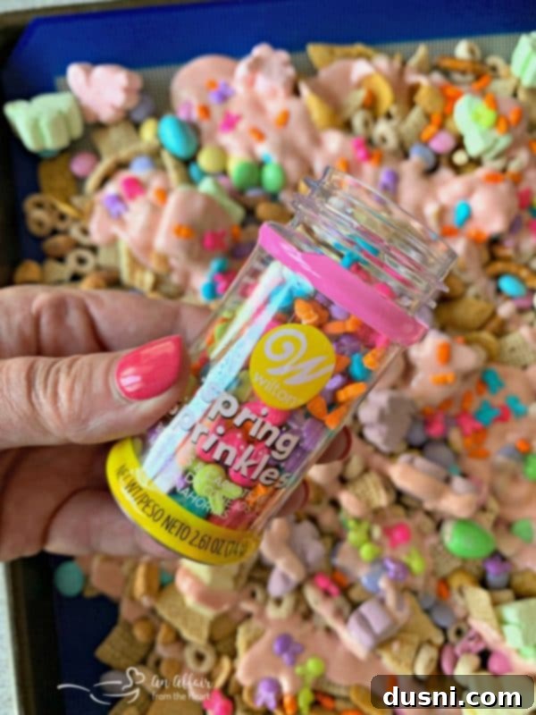 Springtime Sweet Crunch Medley 7 Adding sprinkles to the candy coated snack mix