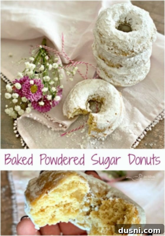 Baked Powdered Sugar Donuts on a wooden board