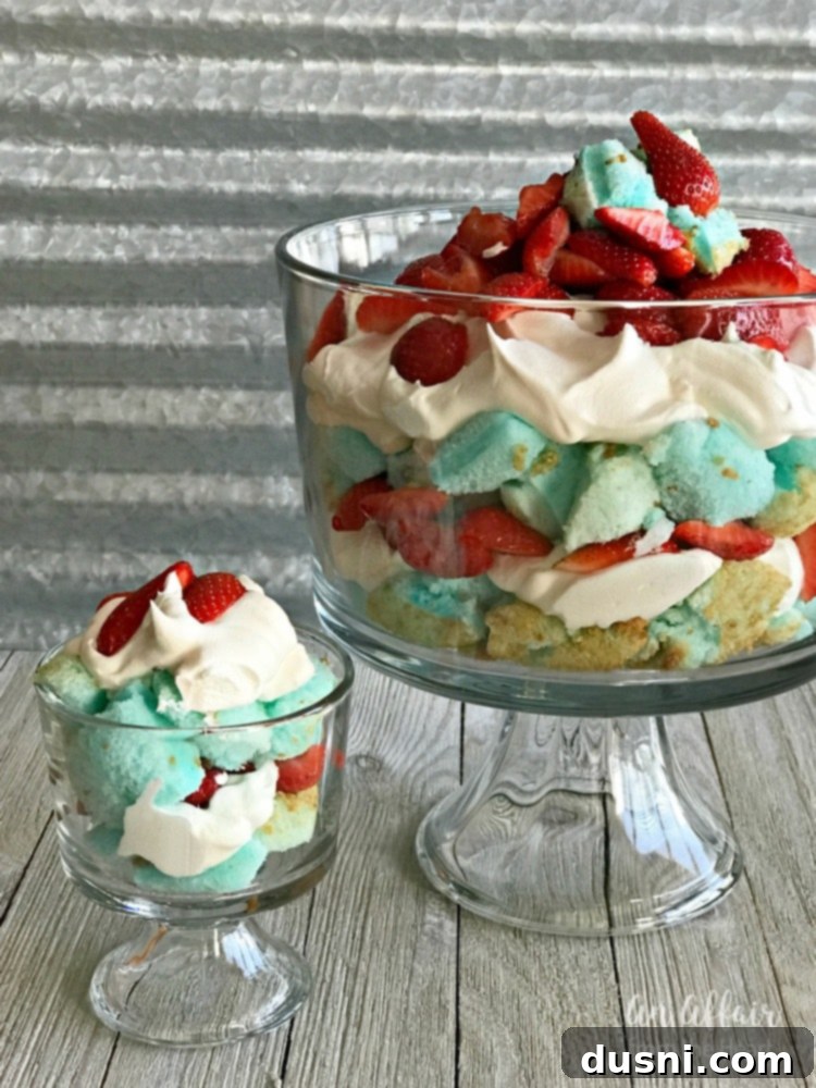 Close-up of Red, White and Blue Strawberry Shortcake Trifle showing layers of cake, whipped topping, and strawberries