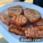 Dorothy's Signature BBQ Pork Chops 13 Dorothy's BBQ Pork Chops on a white platter