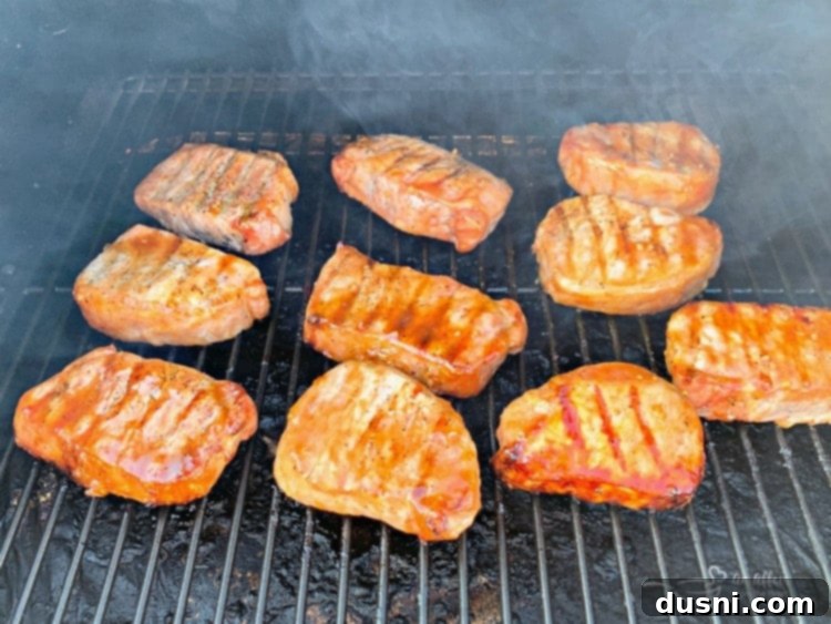 Dorothy's Signature BBQ Pork Chops 9 Dorothy's BBQ Pork Chops with sauce on a grill