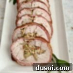 Pastırmalı Lahana Turşusu Dolgulu Domuz Kontrafile 19 Bacon Wrapped Pork Tenderloin on white platter