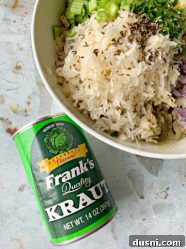 Pastırmalı Lahana Turşusu Dolgulu Domuz Kontrafile 4 Ingredients for sauerkraut stuffing, including a can of Frank's Kraut, chopped onion, and celery, arranged on a cutting board.