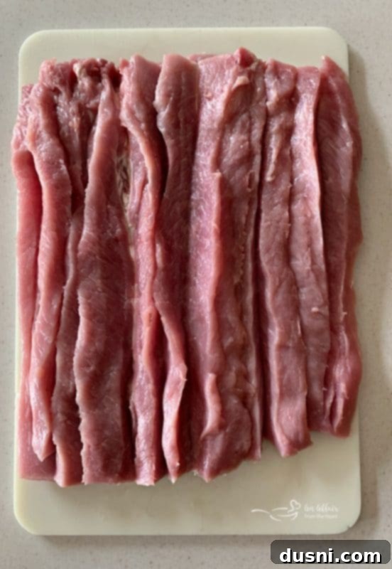 Pastırmalı Lahana Turşusu Dolgulu Domuz Kontrafile 7 How to properly butterfly and cut a pork loin for stuffing, laying it flat on a cutting board.