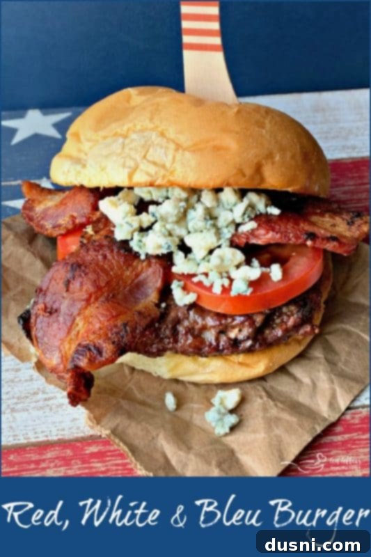 Bloody Mary's Savory Stack 13 Red, White & Bleu Burger on a bun with toppings.