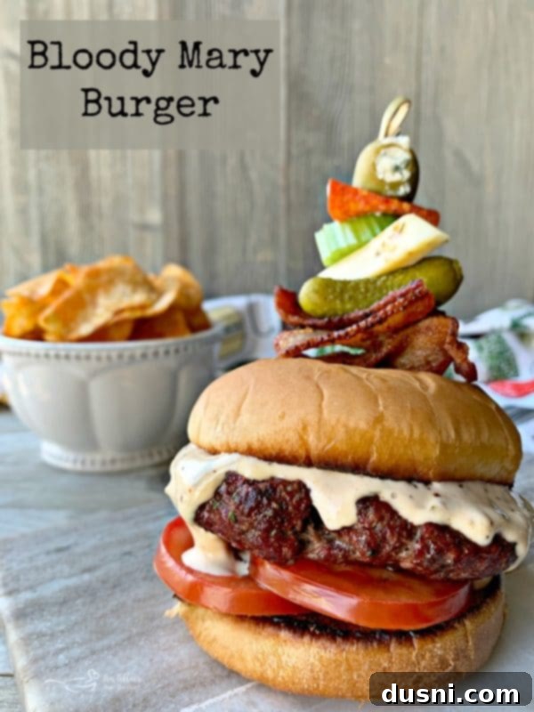 Bloody Mary's Savory Stack 14 A close-up shot of a Bloody Mary Burger, perfectly assembled and ready to eat.
