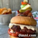 Bloody Mary's Savory Stack 16 Bloody Mary Burger with garnish on grey platter