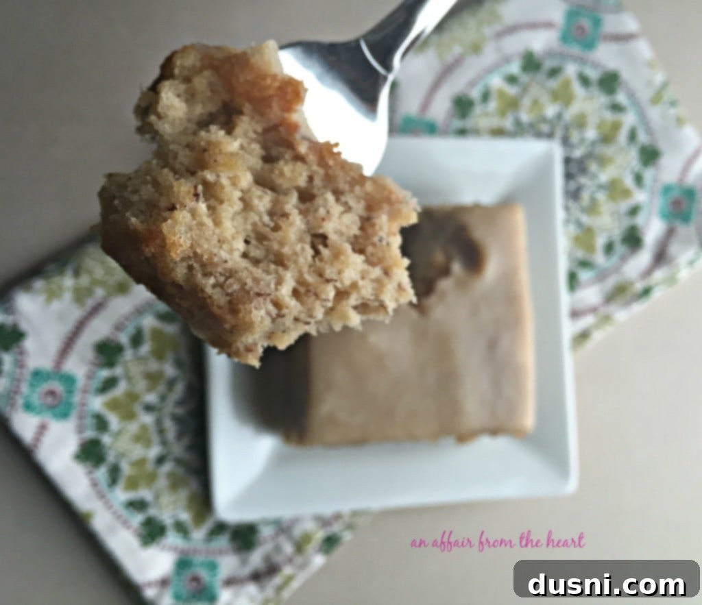 Slice of Banana Bread Cake with Brown Butter Cream Cheese Frosting